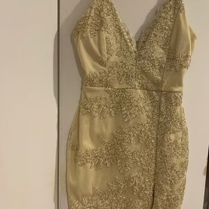 Gold spaghetti strap dress with small thigh split